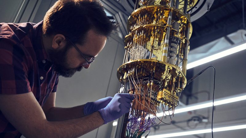 An engineer works on a cooling unit for a quantum computing system in a New York lab. The technology could crack 'traditional' encryption in seconds