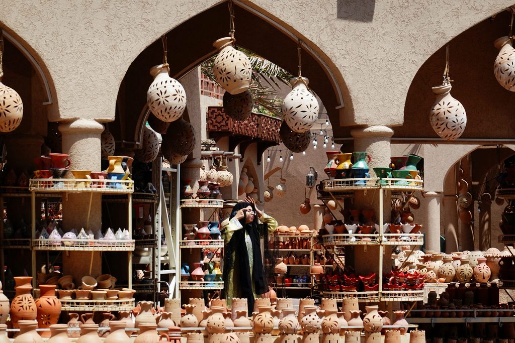 A woman at a souq in Oman. The country's Central Bank has approved Bank Muscat's plans to invest in GCC-listed institutions