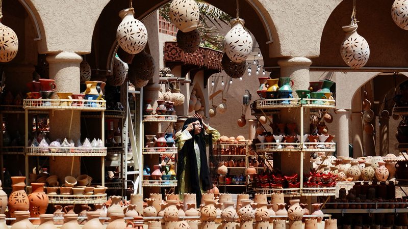 A woman at a souq in Oman. The country's Central Bank has approved Bank Muscat's plans to invest in GCC-listed institutions