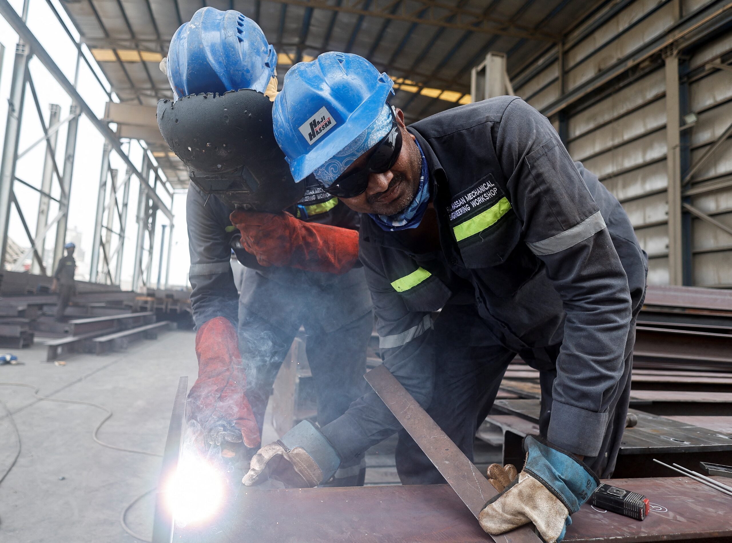 These workers at a factory in Manama, Bahrain, could soon be enjoying a three-day weekend if the government goes ahead with proposed changes