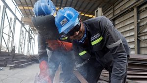 These workers at a factory in Manama, Bahrain, could soon be enjoying a three-day weekend if the government goes ahead with proposed changes
