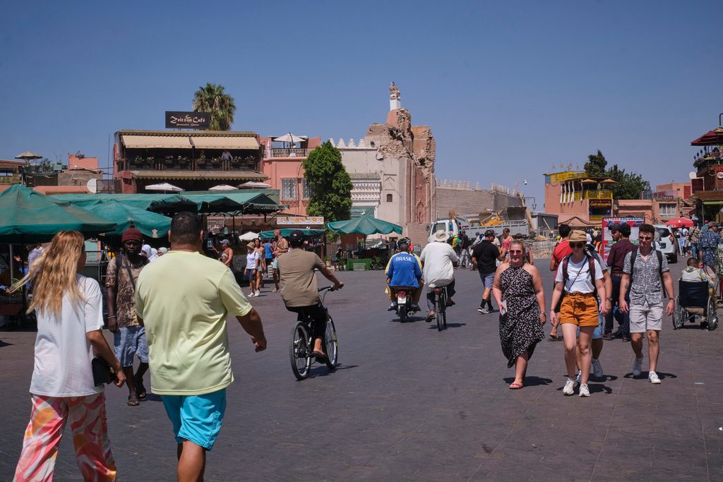 Tourists stroll through Jemma el Fna Square in Marrakech just days after an earthquake struck Morocco