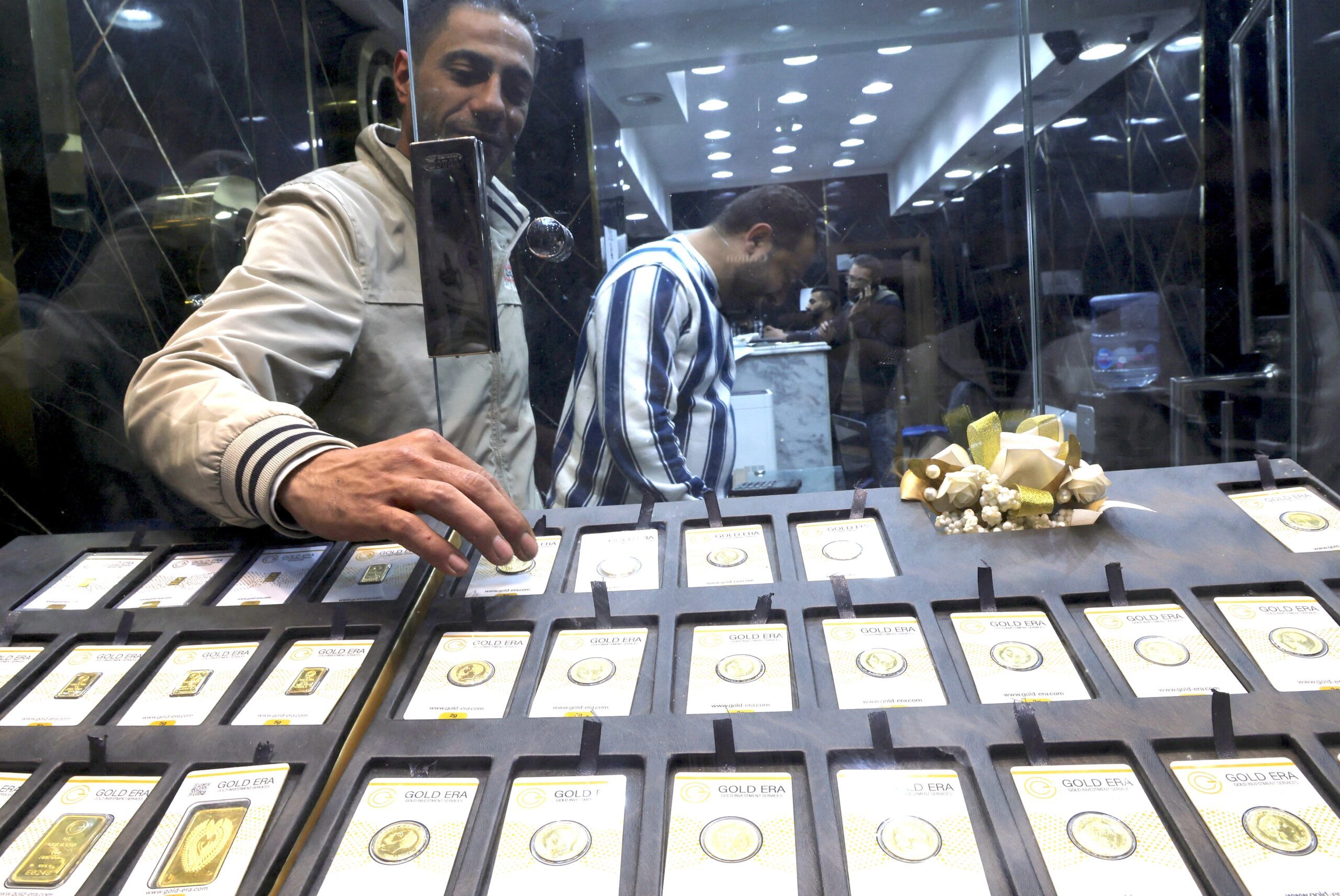 Gold vendors in Cairo. The Egyptian government will devalue the pound further in March
