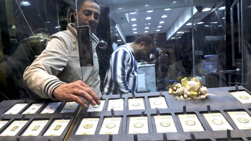 Gold vendors in Cairo. The Egyptian government will devalue the pound further in March