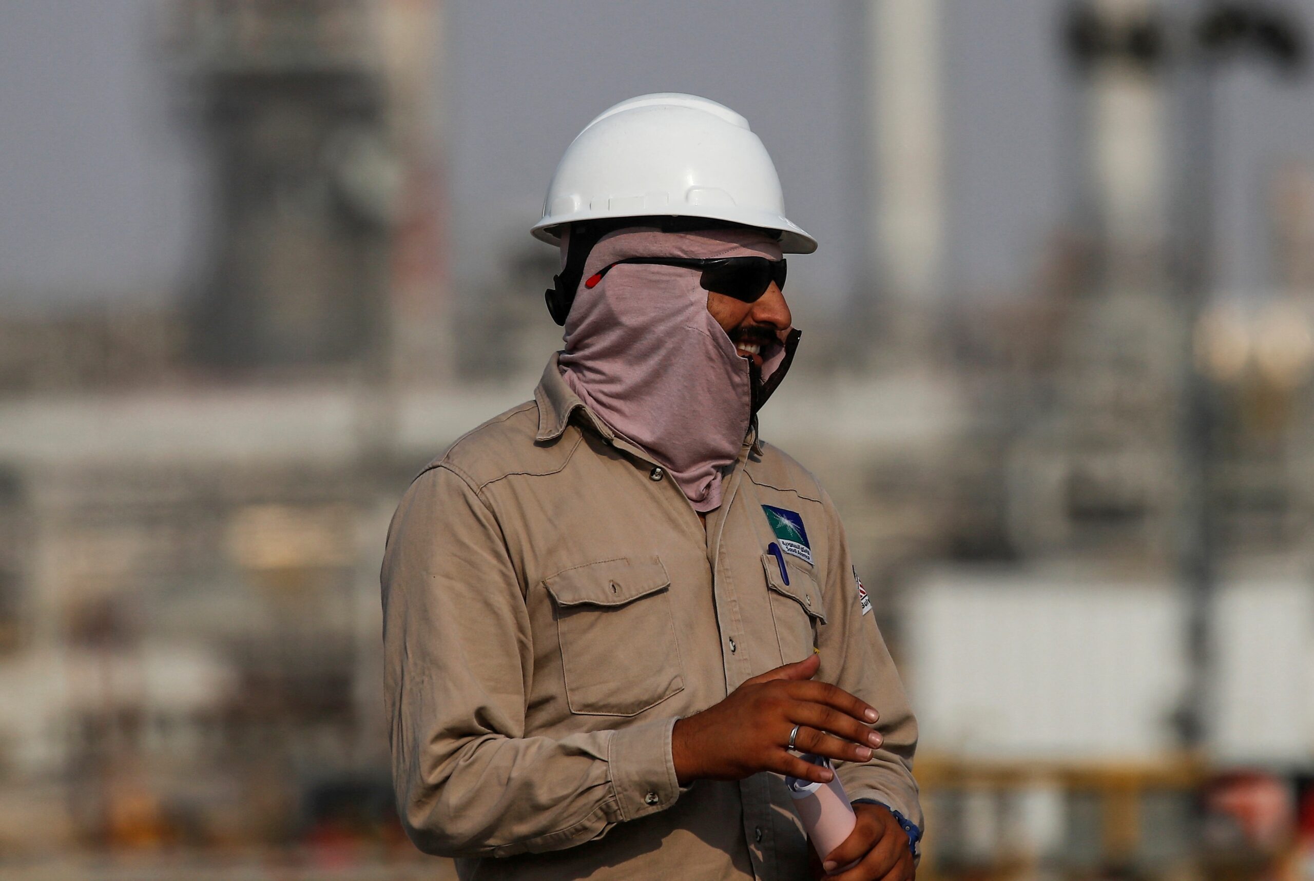 A Saudi Aramco employee at an oil facility in Abqaiq. The IMF downgraded Saudi Arabia's 2024 GDP forecast from 4% to 2.7%