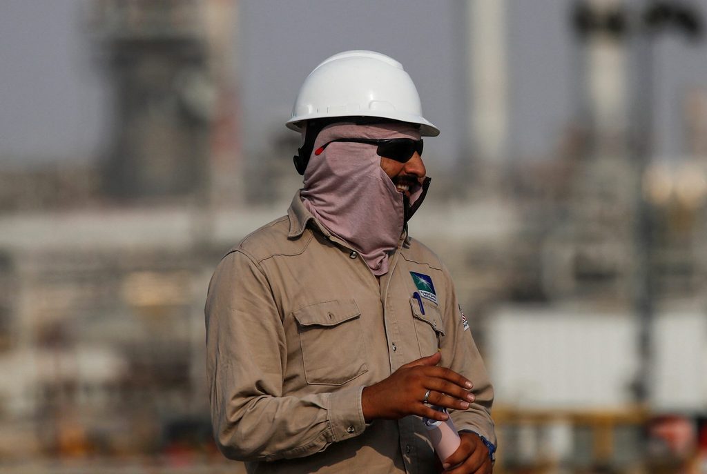 A Saudi Aramco employee at an oil facility in Abqaiq. The IMF downgraded Saudi Arabia's 2024 GDP forecast from 4% to 2.7%