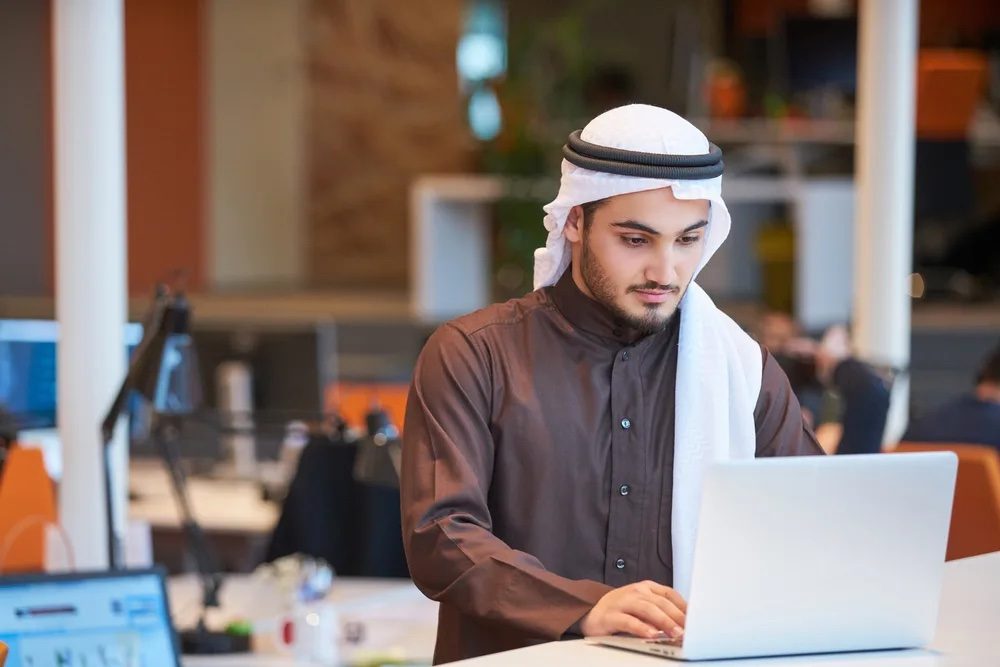 Arabian businessman working in modern office Additional funds will be used by Aramco Ventures to support startups in a variety of sectors, from tech to sustainable development