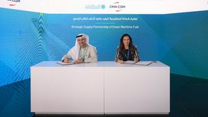 Mohammad Abdelqader El Ramahi, Masdar chief green hydrogen officer, and CMA CGM's Christine Cabau Woehrel sign the strategic supply partnership on green fuel