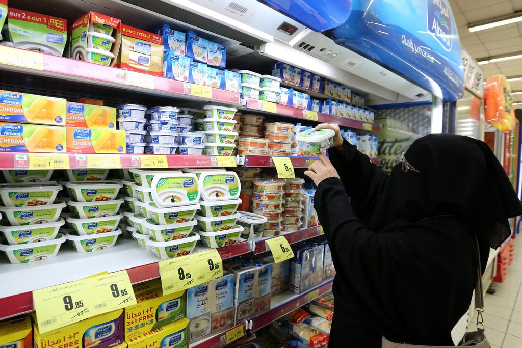 A Saudi woman shops for dairy products at a Riyadh supermarket. Wholesale price inflation for dairy products was 14.3% in December
