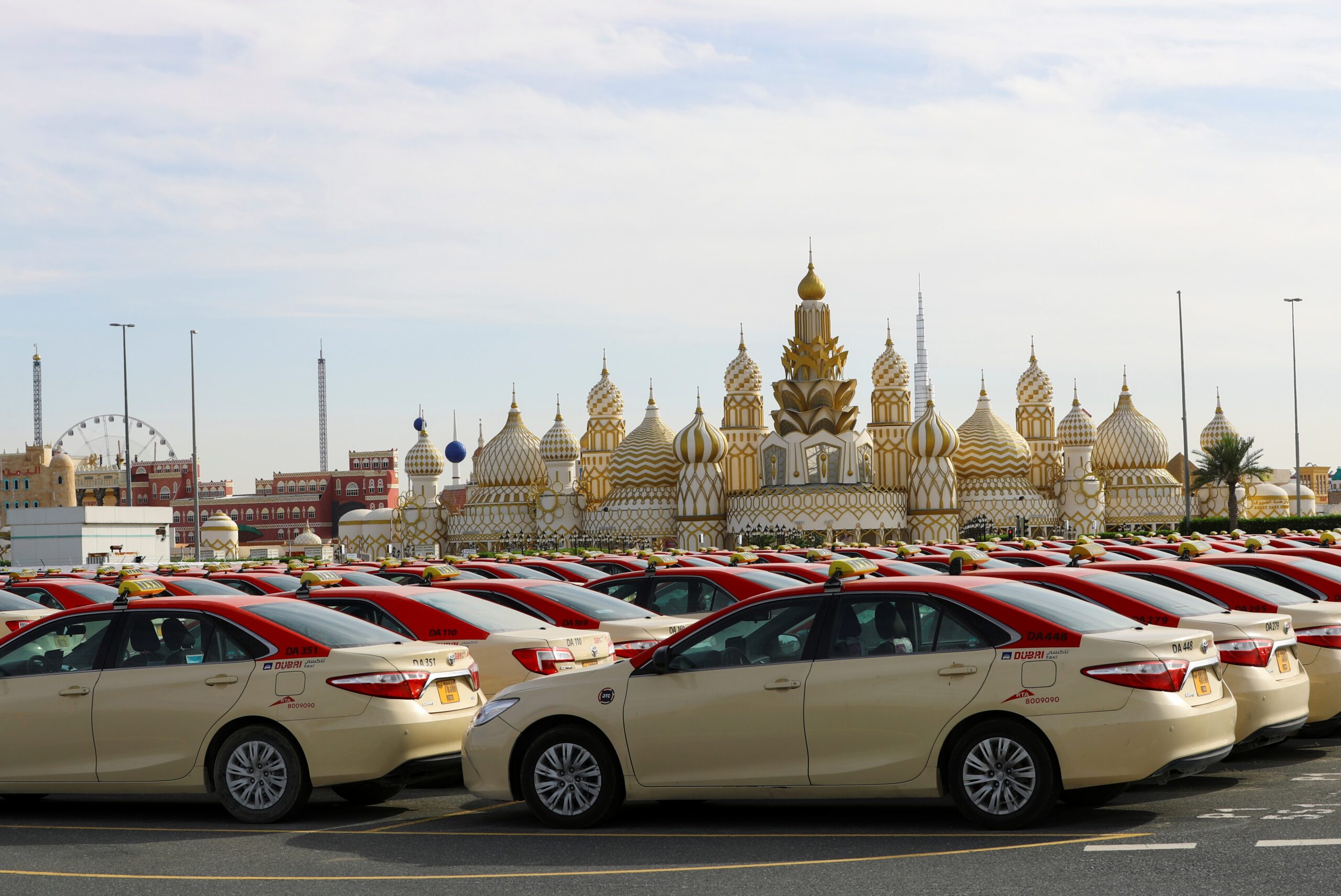 Dubai Taxi vehicles in front of Dubai Global Village. Taxis and limousines completed 46 million trips, up 8% year on year