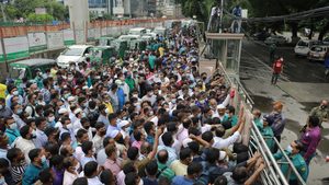 Workers in Bangladesh wait to travel to Saudi Arabia. Migrant workers have been sending remittances in smaller amounts.