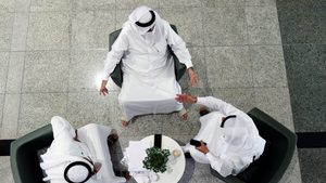 People speak in the lobby of the Dubai Financial Market. Strict IPO rules mean loss-making startups cannot go public