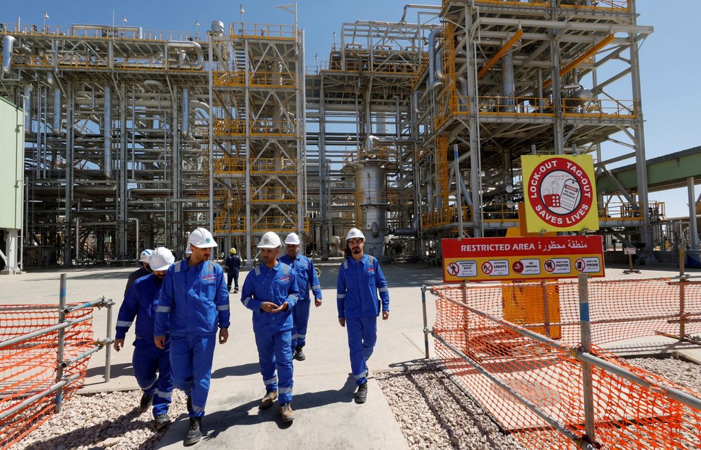 Workers at an oil refinery in Kerbala. Iraq cut about a third of the amount needed to meet its voluntary output target