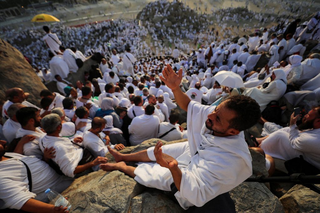 Muslim pilgrims pray on the Mount of Mercy outside the holy city of Mecca during the annual hajj pilgrimage in 2023