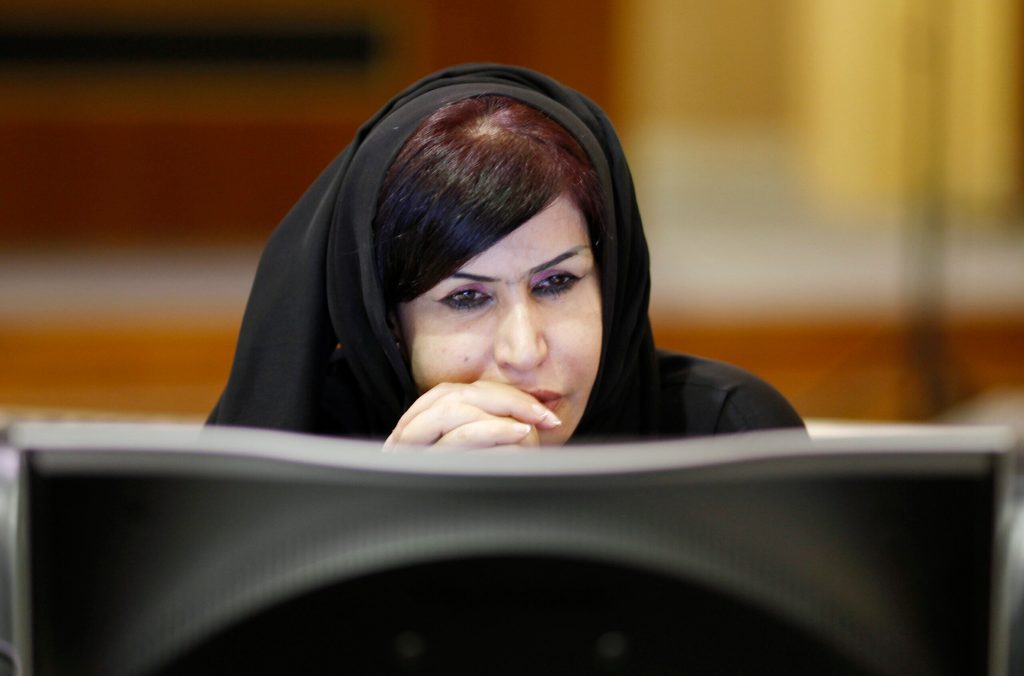 AI cybersecurity arab woman computer screen
