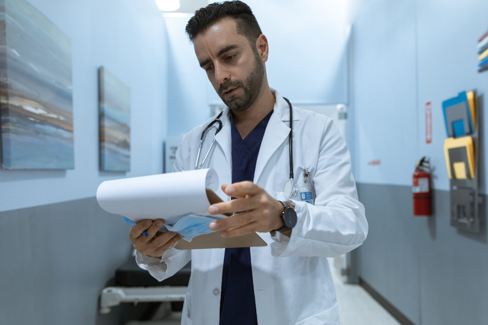 Healthcare providers are struggling in a crowded market and facing rising costs a concerned doctor looks at a chart hospitals Dubai hospitals