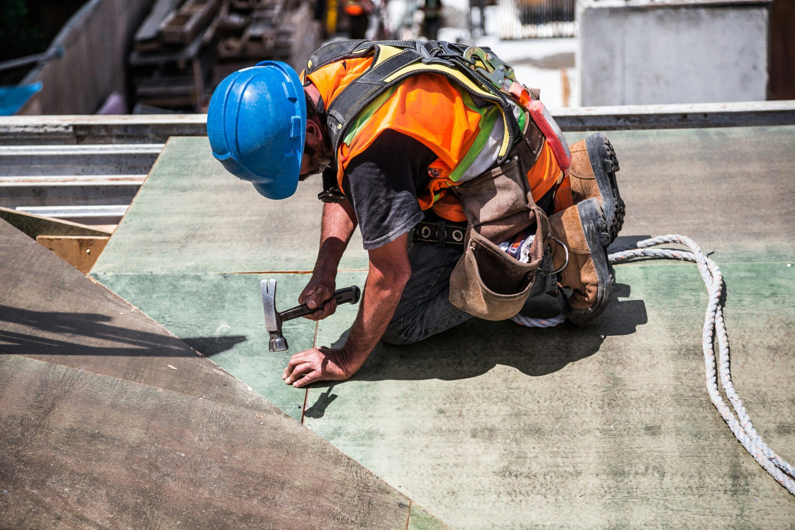 Person, Worker, Device The construction sector has been a particular focus of the Saudi government's attempt to drive out corruption man with hammer on construction site