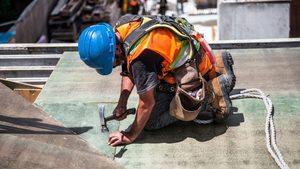Person, Worker, Device The construction sector has been a particular focus of the Saudi government's attempt to drive out corruption man with hammer on construction site