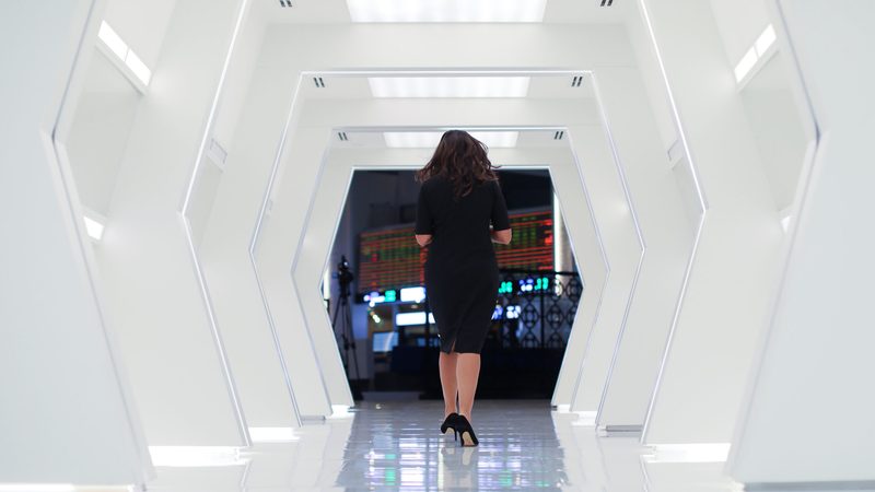 International investors Gulf markets woman walking at Dubai Financial Market