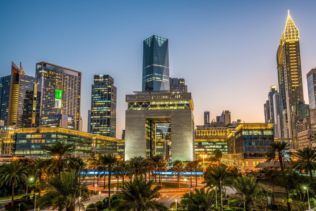 The palm trees providing shade among the modern buildings are the only hint of this being a 'village' in Dubai