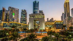 The palm trees providing shade among the modern buildings are the only hint of this being a 'village' in Dubai
