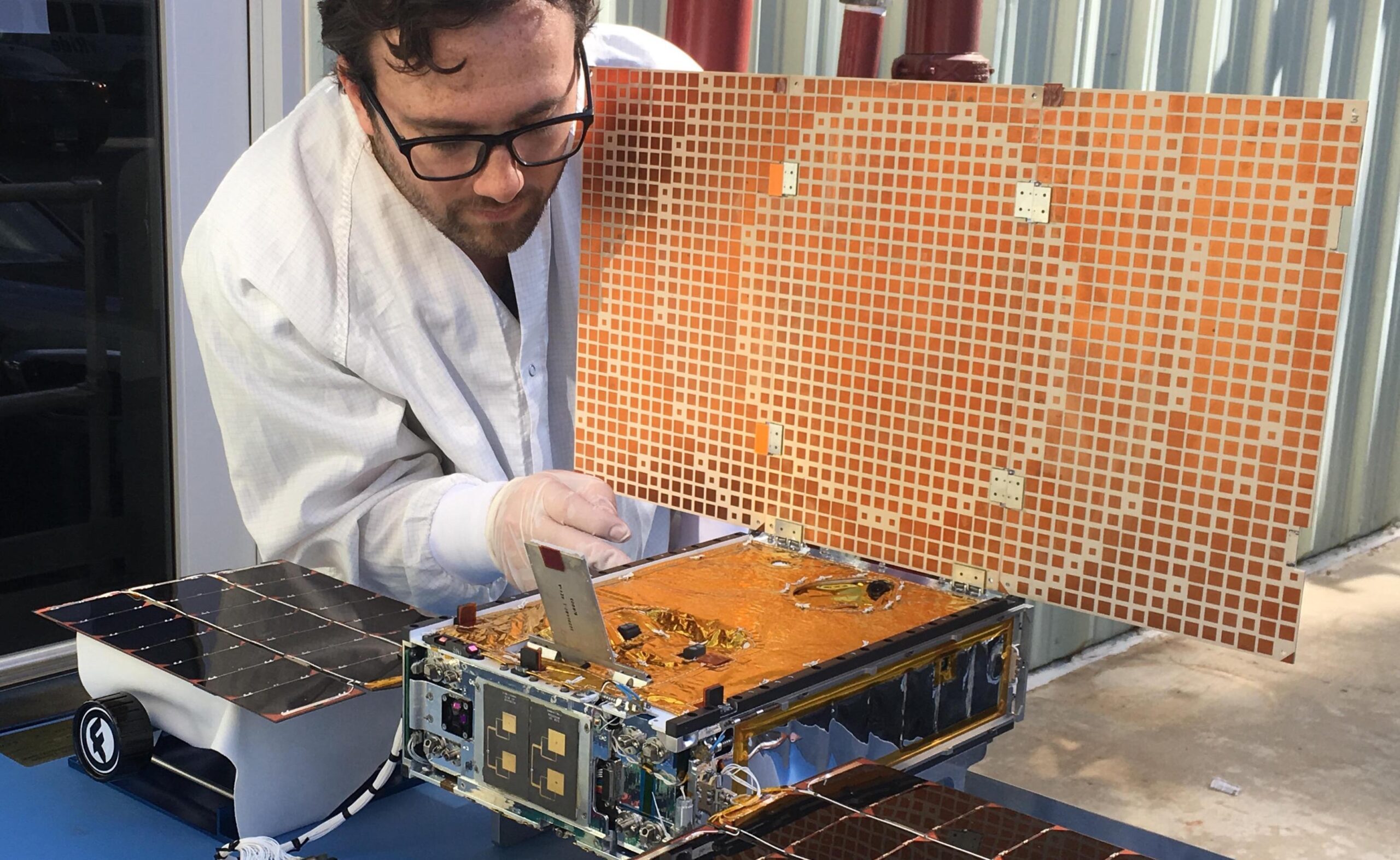 A NASA engineer tests a CubeSat's solar array. Small, modular CubeSats can help a range of Saudi monitoring programmes.