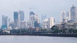 Marine Drive in Mumbai, with city high rises behind. Mubadala and Goldman Sachs plan to invest in India