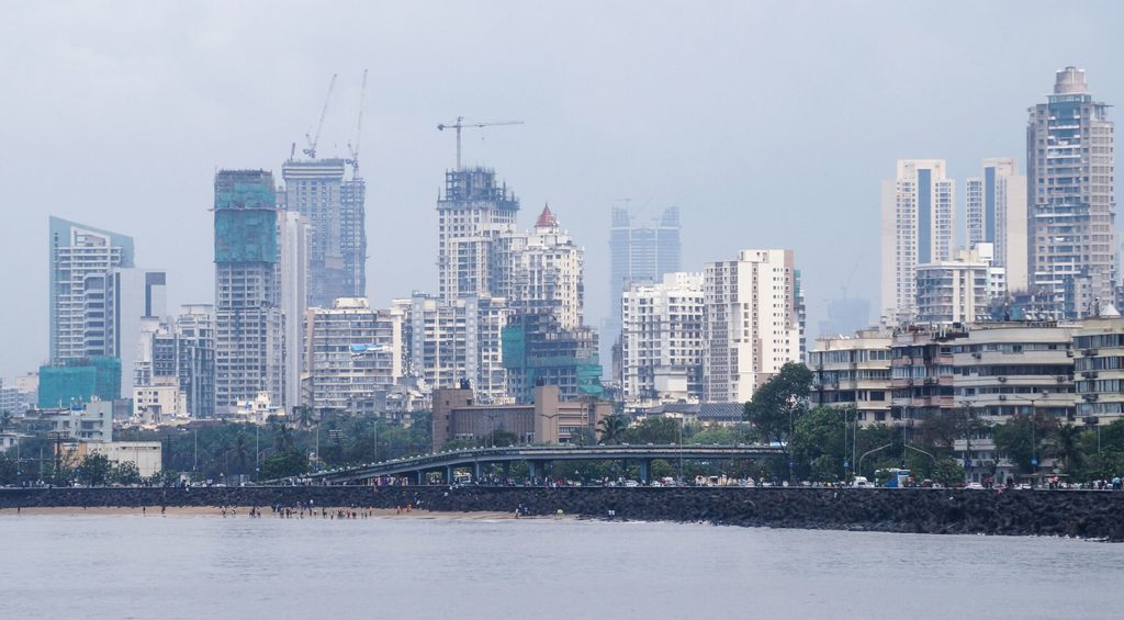 Marine Drive in Mumbai, with city high rises behind. Mubadala and Goldman Sachs plan to invest in India