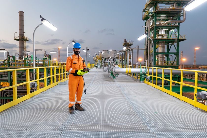 A worker at the Zohr gas processing plant. Adnoc now has a stake in the giant field