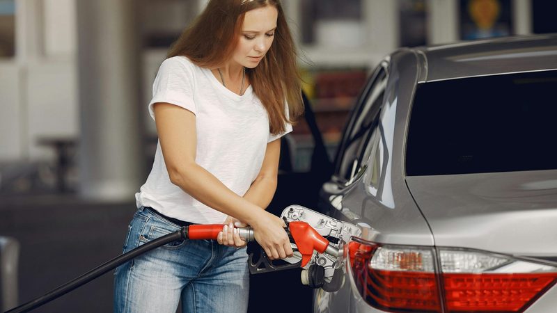 A woman at petrol pump. US politicians who label Opec a price-fixing cartel may have to rethink