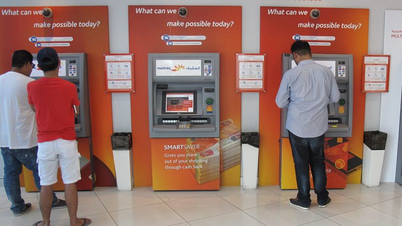 People using Mashreq Bank ATMs in Dubai. UAE banks’ combined net profit was a record AED 76.9bn in 2023