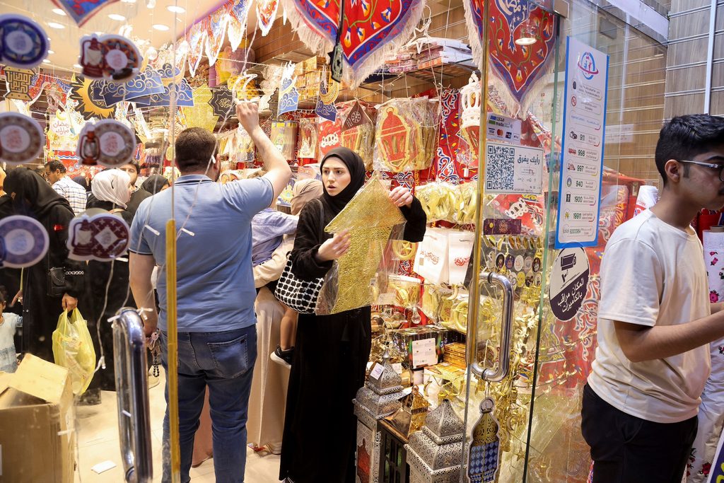 Person, Shopping, Adult A Saudi woman shops for Ramadan decorations to mark the beginning of the Holy Month of Ramadan in a local market in Riyadh, Saudi Arabia, March 22, 2023. REUTERS/Ahmed Yosri