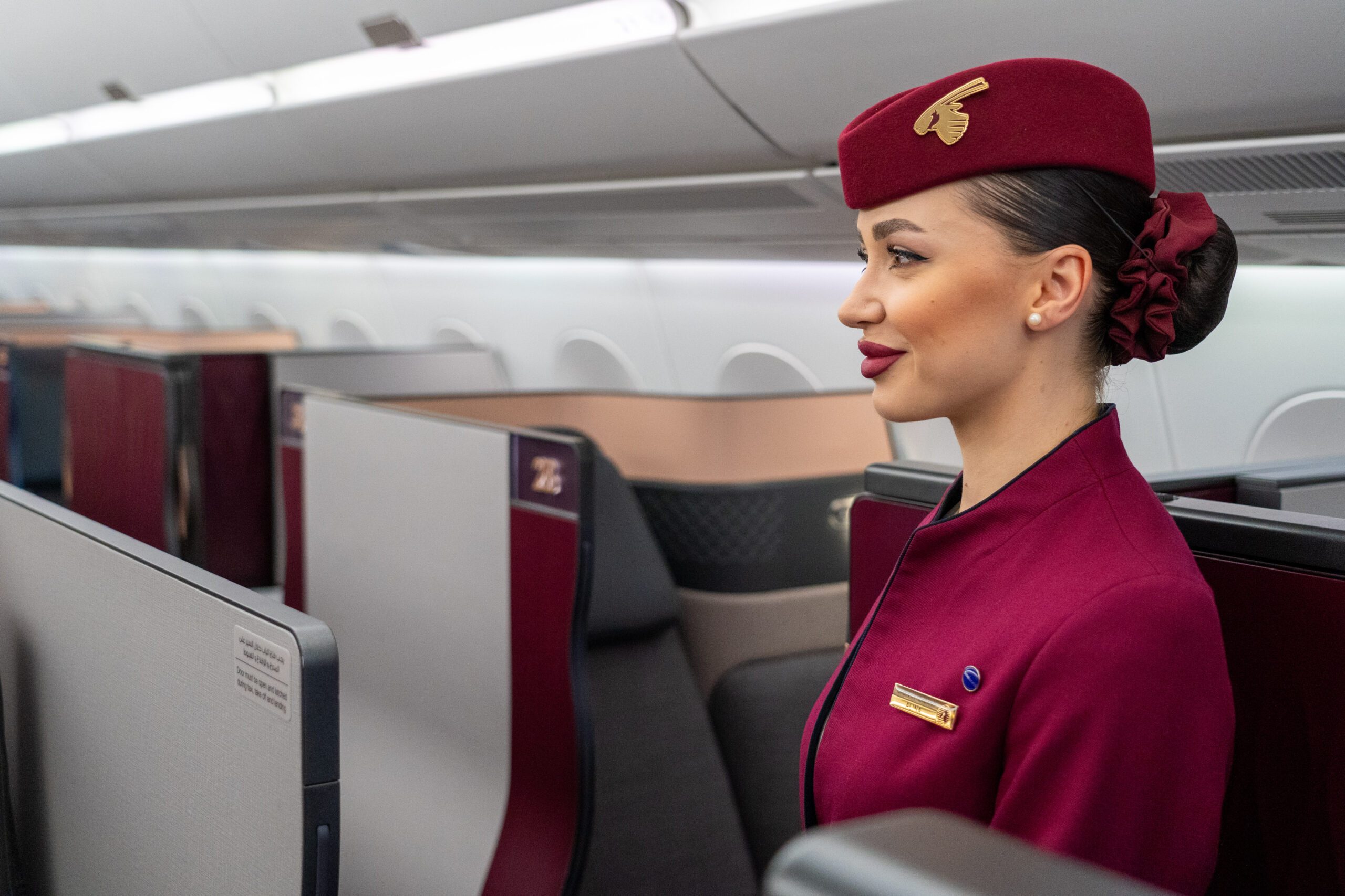 A Qatar Airways flight attendant on board an A350 at the Dubai Airshow. The airline has a further 184 of the model due