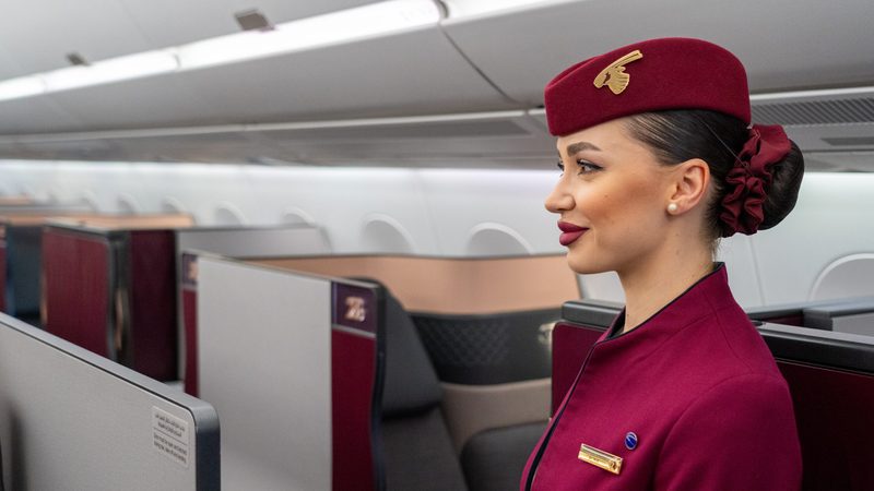 A Qatar Airways flight attendant on board an A350 at the Dubai Airshow. The airline has a further 184 of the model due