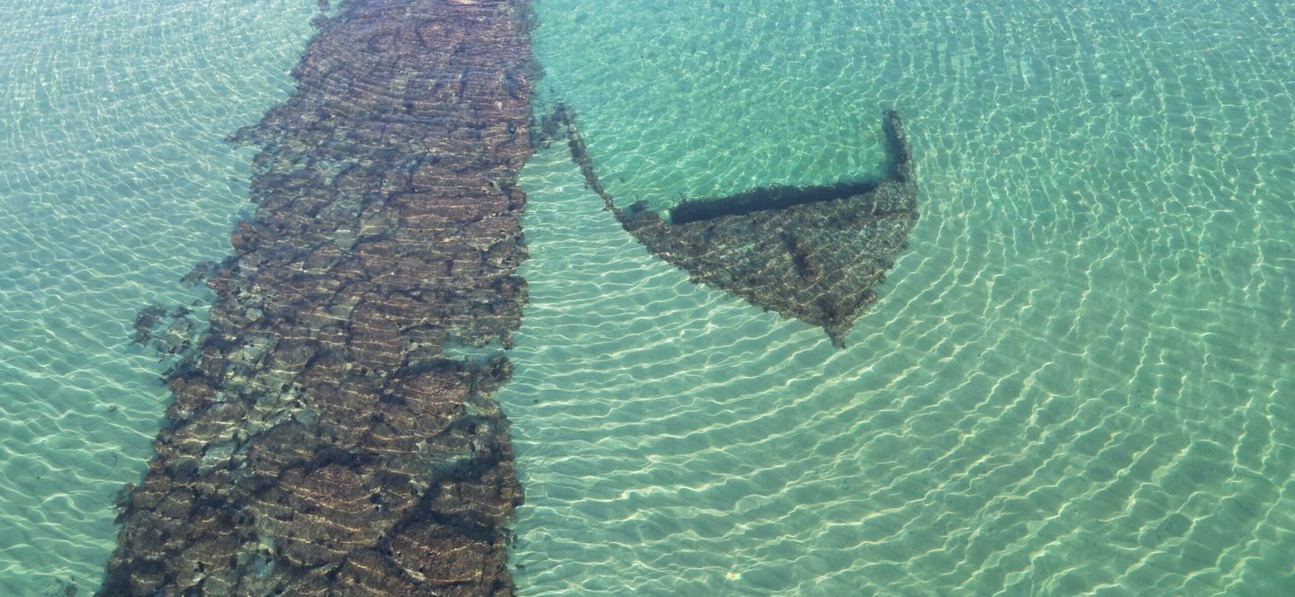 The wreck of a barge, sunk by Turkish gunfire, lying along side a pier built by British engineers