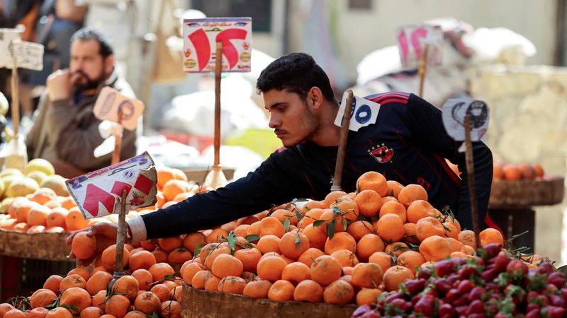 An Egyptian fruit seller works at a market in Cairo, Egypt, March 7, 2024 REUTERS/Mohamed Abd El Ghany