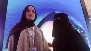 Saudi Arabia's first robot, Sara, is inspected by a visitor at Leap in 2023. This year she was joined by a male counterpart, Mohammad
