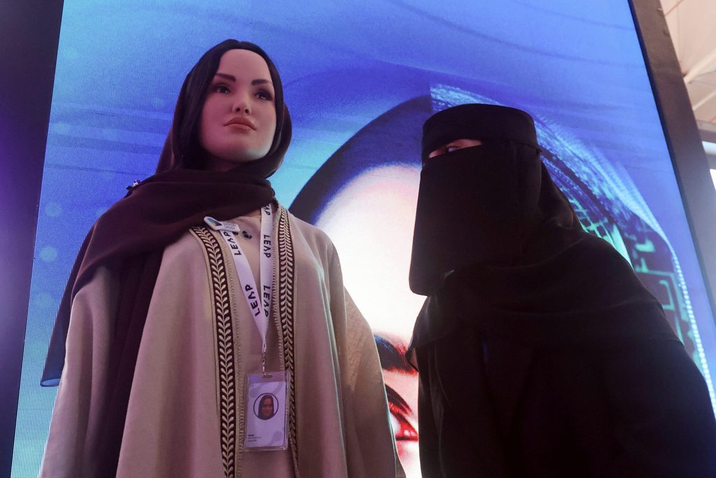Saudi Arabia's first robot, Sara, is inspected by a visitor at Leap in 2023. This year she was joined by a male counterpart, Mohammad