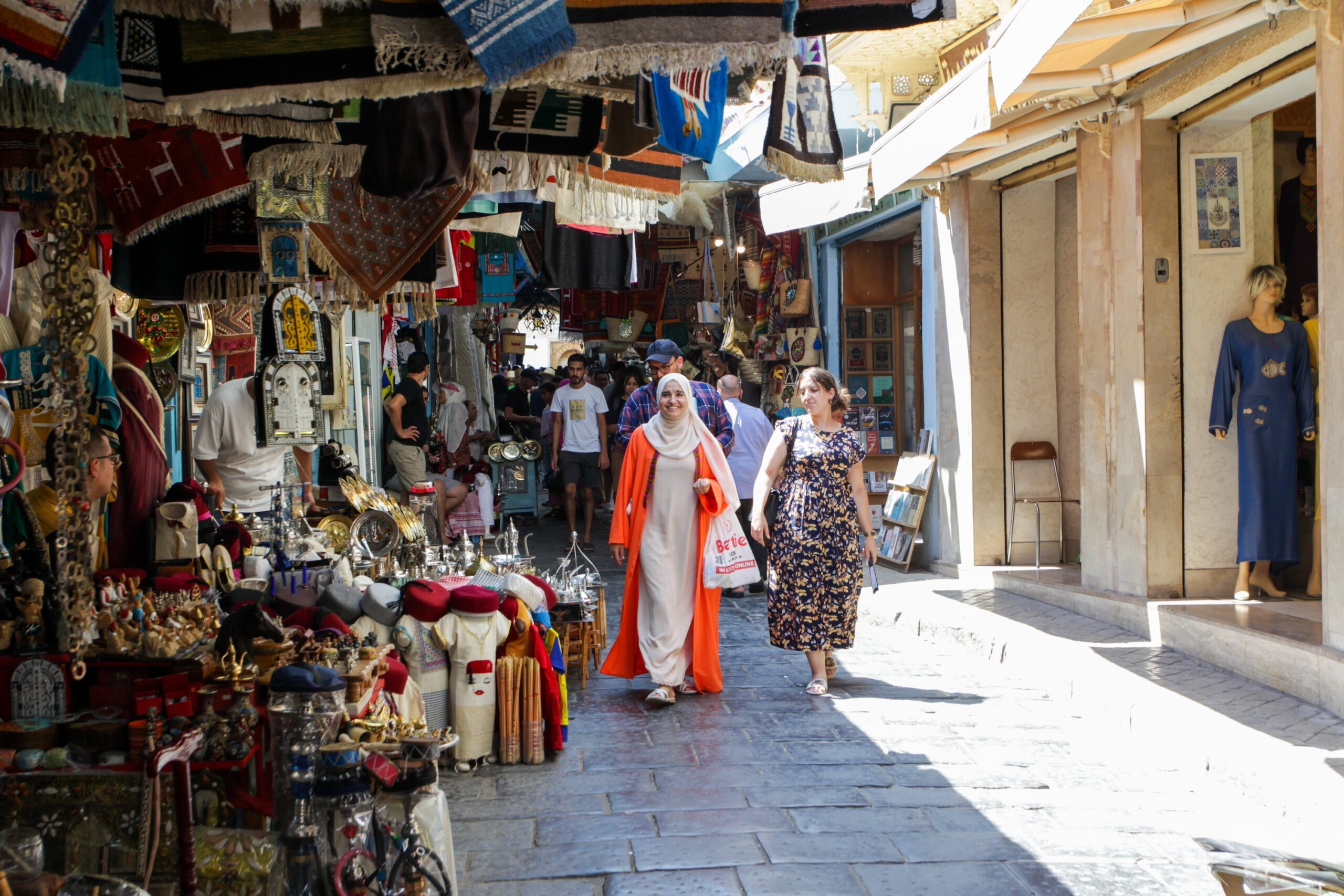 People are seen out shopping in the old city of Tunis, Tunisia, 23 August 2023. Tunisia's Ministry of Tourism and Handicrafts has officially restarted tourism in the country after the challenges caused by COVID-19 in 2020. Up to 10 August 2023, a total of 5.4 million tourists have picked Tunisia for their vacations (Photo by Yassine Mahjoub/NurPhoto)NO USE FRANCE