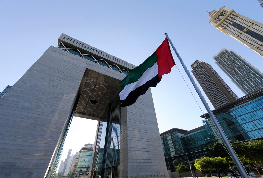 The UAE flag flies at the Dubai International Finance Centre. Removal from the grey list should increase investors' trust in the UAE and draw FDI