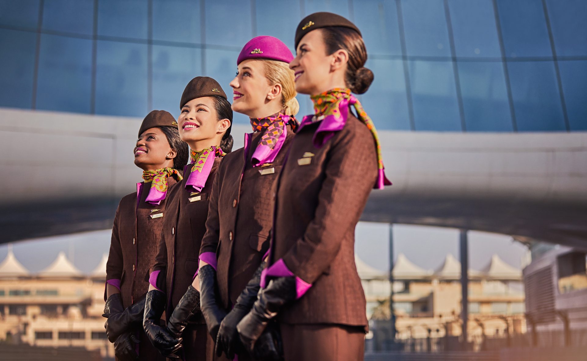 Etihad crew catered to 14 million passengers in 2023, resulting in a 31 percent rise in passenger revenue to AED16.6 billion women cabin crew Etihad airline smiling