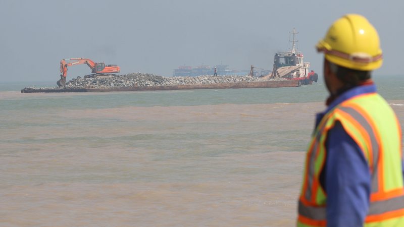 A worker at Al Faw Grand Port. The Development Road project aims to connect the port with Turkey