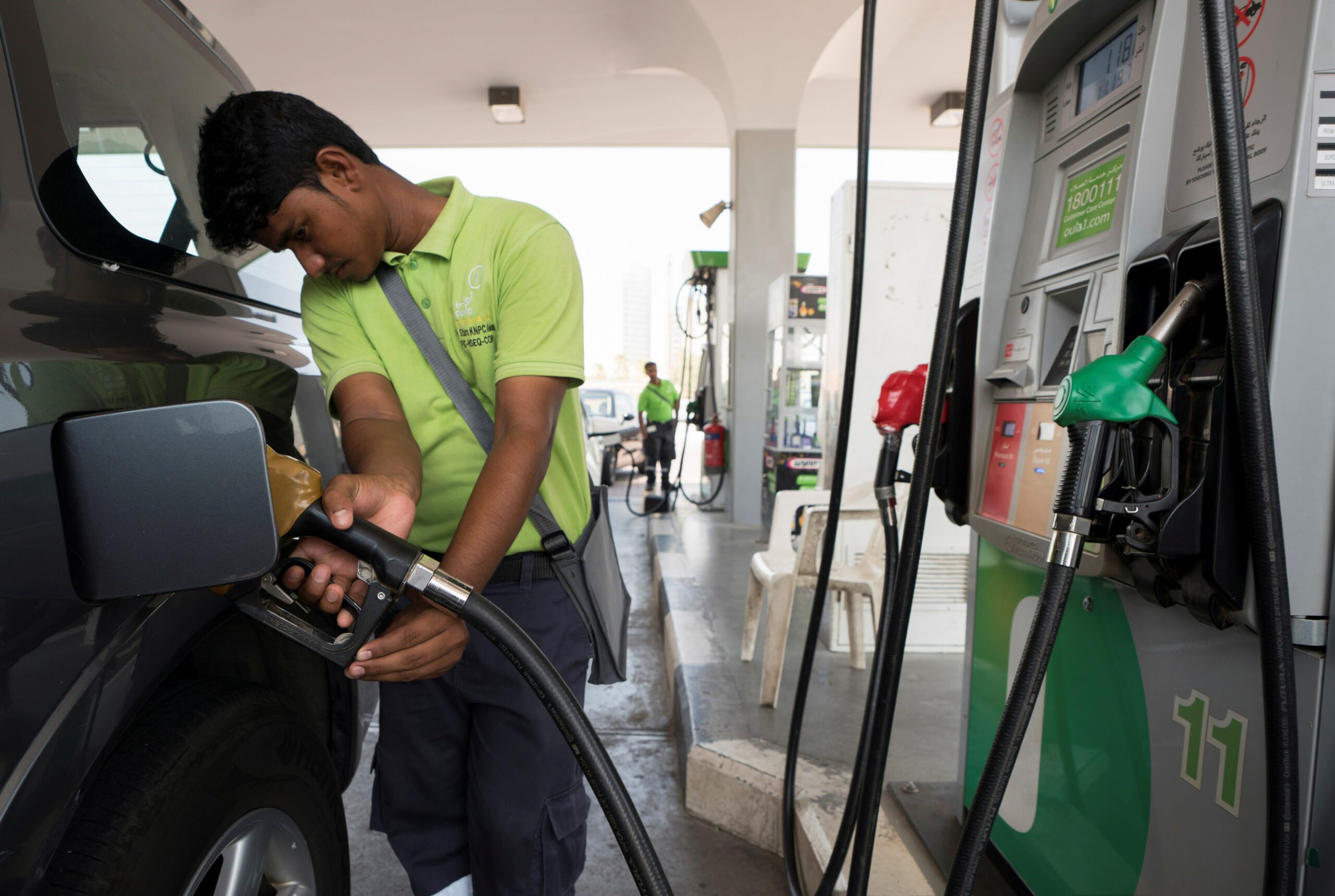 A worker at a petrol station in Kuwait City. Kuwait is the GCC nation most economically dependent on hydrocarbons, according to the EDI