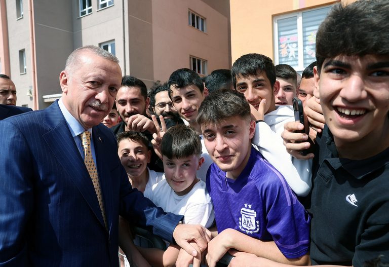 President Recep Tayyip Erdoğan poses with supporters on March 31. He is expected to 'stick with' his finance minister and economic programme despite the result