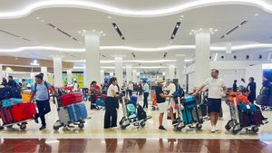 Passengers queue at Dubai airport after last week's storm led to flight delays and cancellations