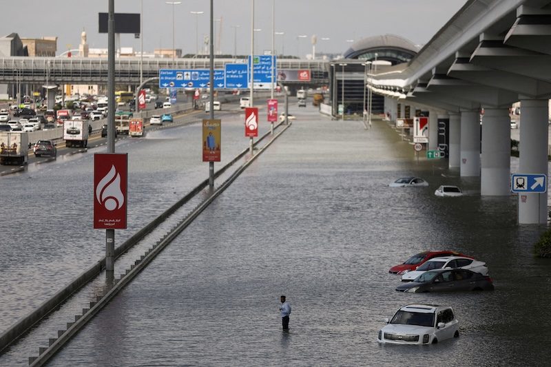 Abandoned cars on a flooded road in Dubai