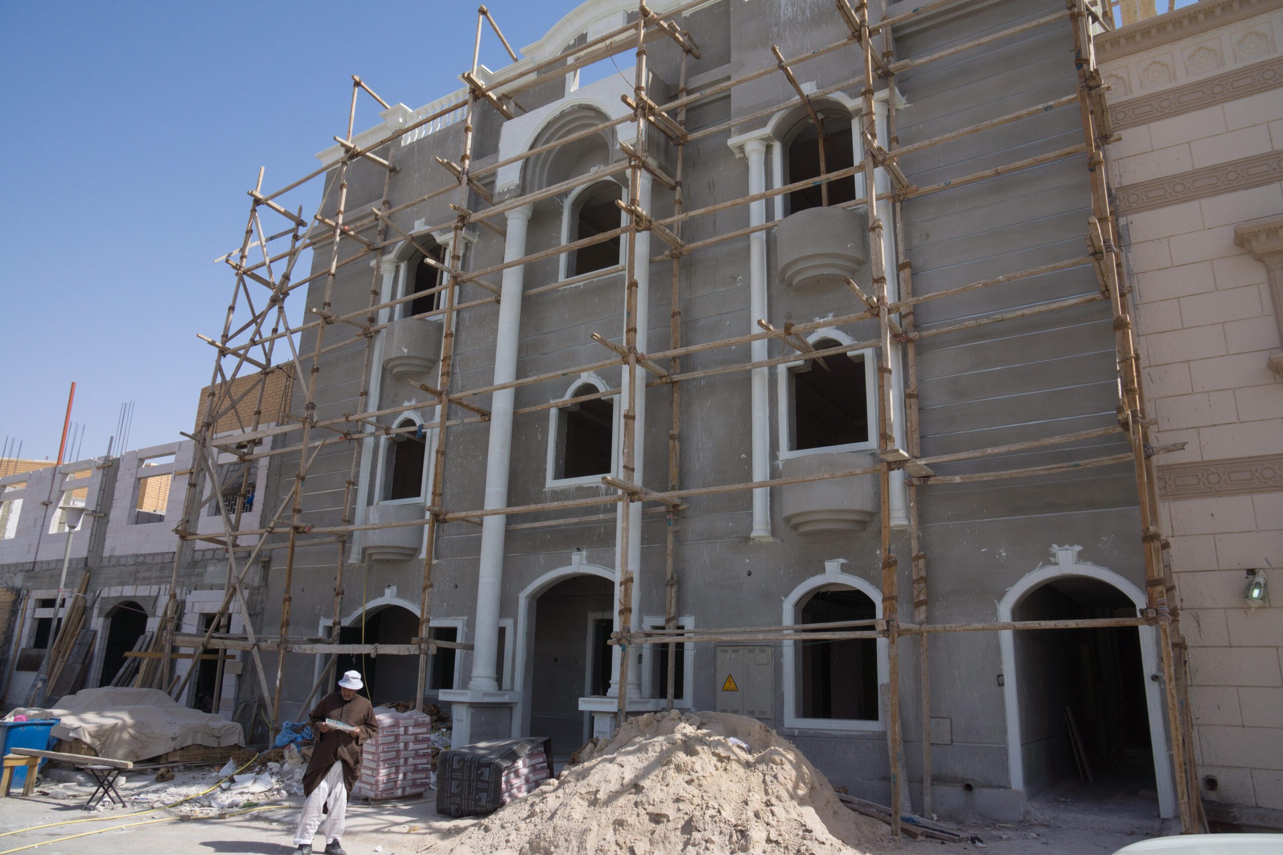 Construction work in Kuwait. Nurseries, schools and shops are being built for the new residential district of Al Metlaa