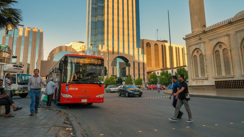 Passengers board a bus in Riyadh. Saudi transport costs fell 1.8 percent year on year