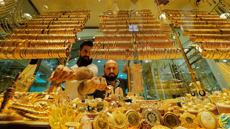 Goldsmiths arrange products in a jewellery store in Istanbul. Demand for gold is rising sharply in Turkey