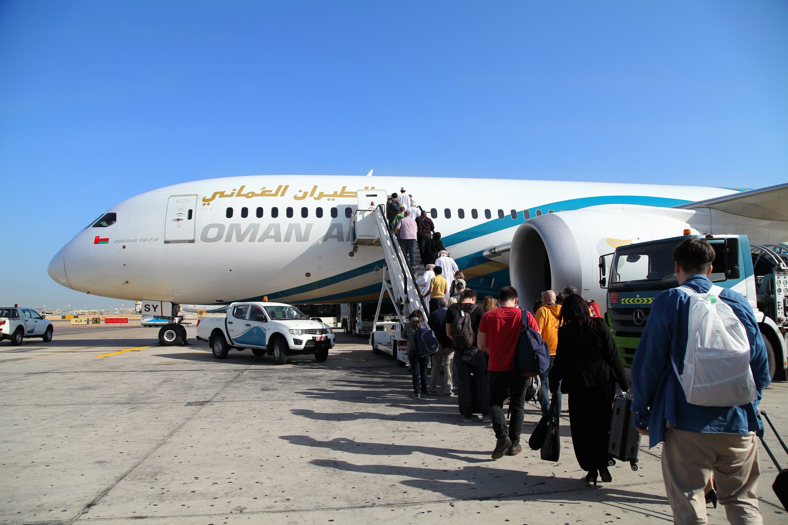 Oman Air revenue people boarding aircraft